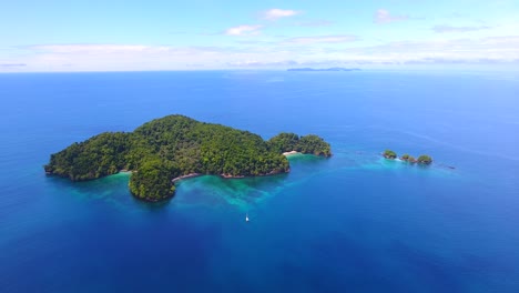 a sailing yacht anchorage on the leeward side of a remote island in a tropical archipelago in central america near panama