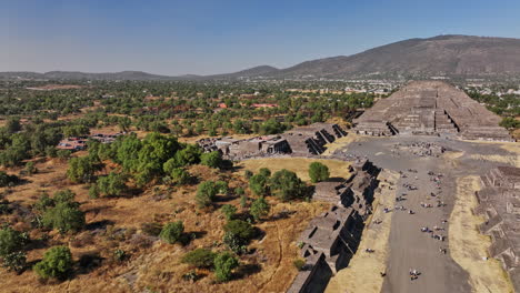 teotihuacan mexico aerial v3 cinematic low level flyover avenue of the dead and leading to the historic landmark cultural heritage pyramid of the moon - shot with mavic 3 cine - december 2021