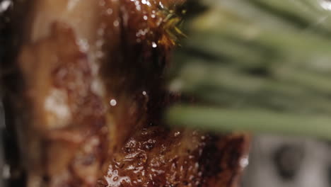 Close-up-on-Fried-Chicken-Rubbed-on-Top-with-Sunflower-Oil-with-Green-Cooking-Tool,-Portrait