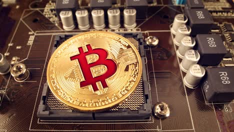 gold bit coin btc coins on the motherboard. bitcoin is a worldwide cryptocurrency and digital payment system called the first decentralized digital currency.