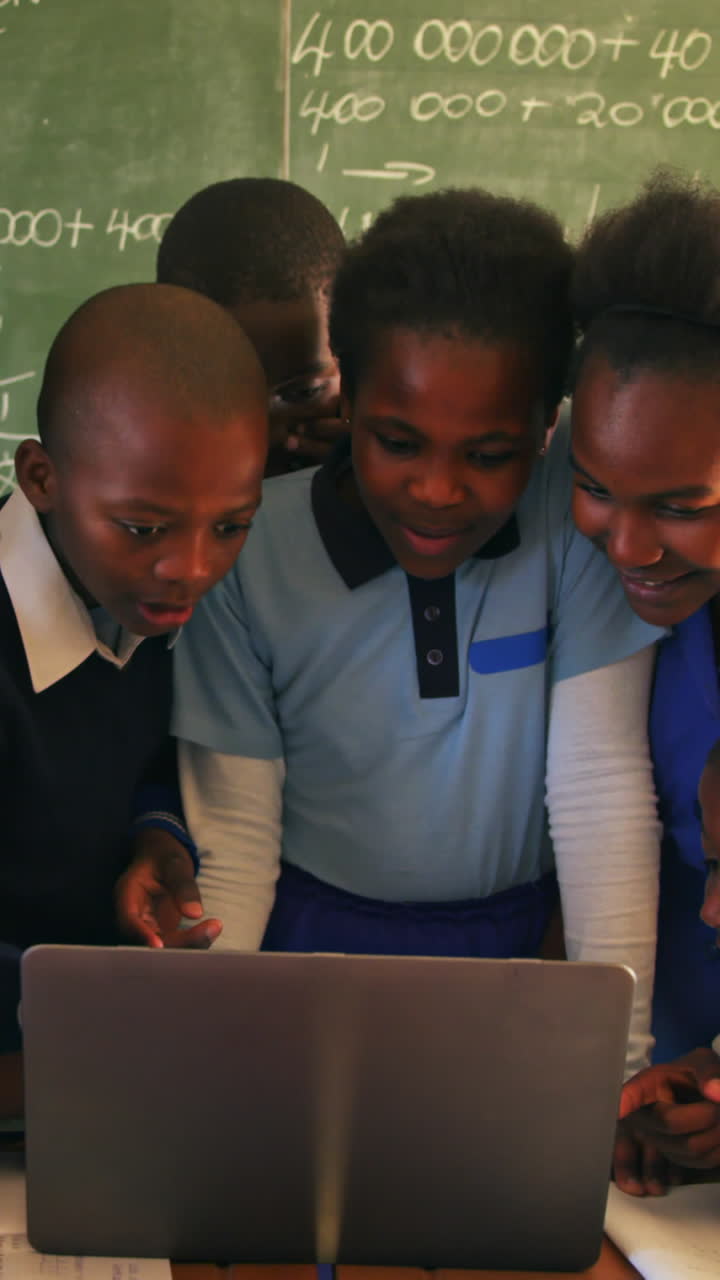 Schoolchildren with laptop in a lesson at a township school 4k