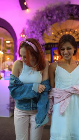 two friends laughing outdoors