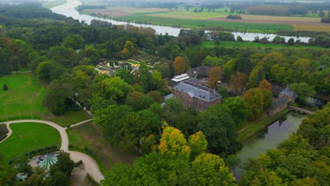 dutch limburg riverbed landscape with historic castle next to meuse