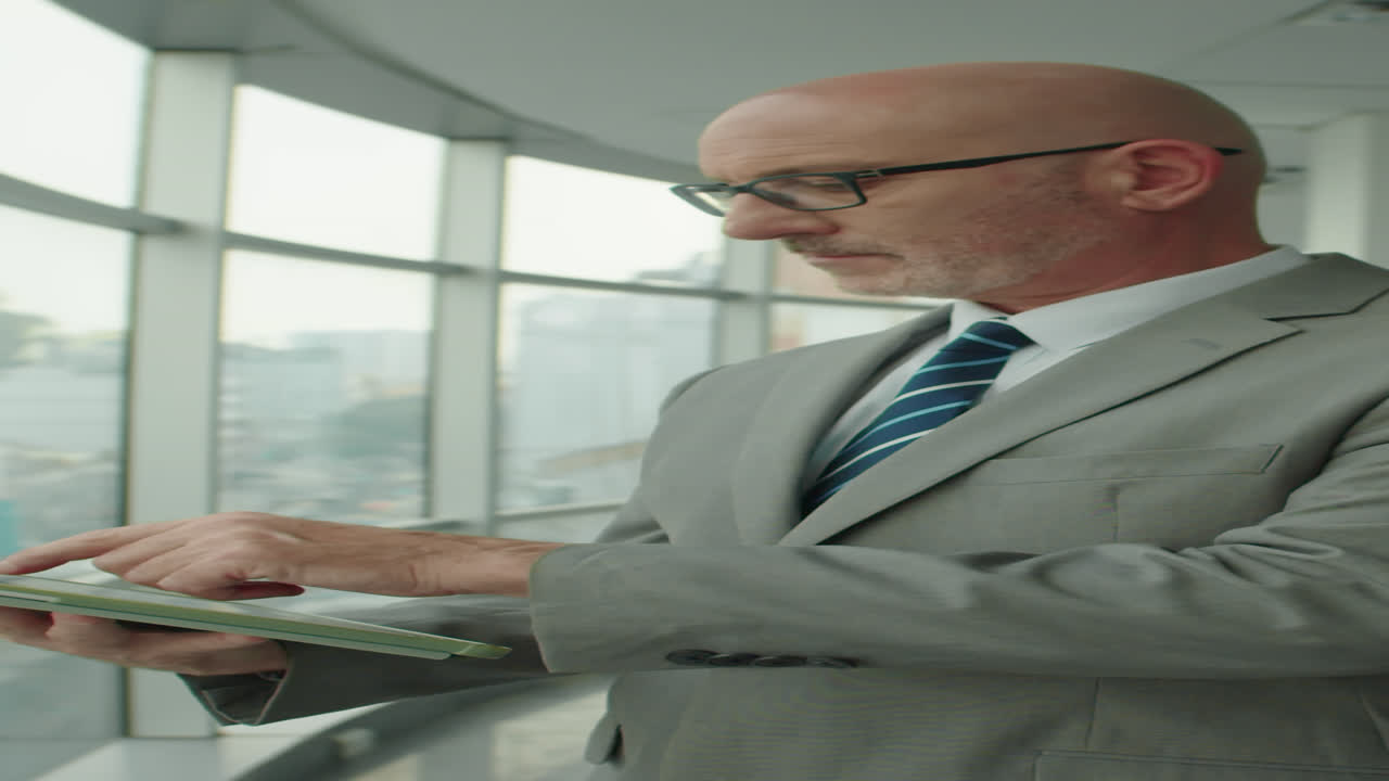 Vertical of Mature Solopreneur Working on Tablet PC