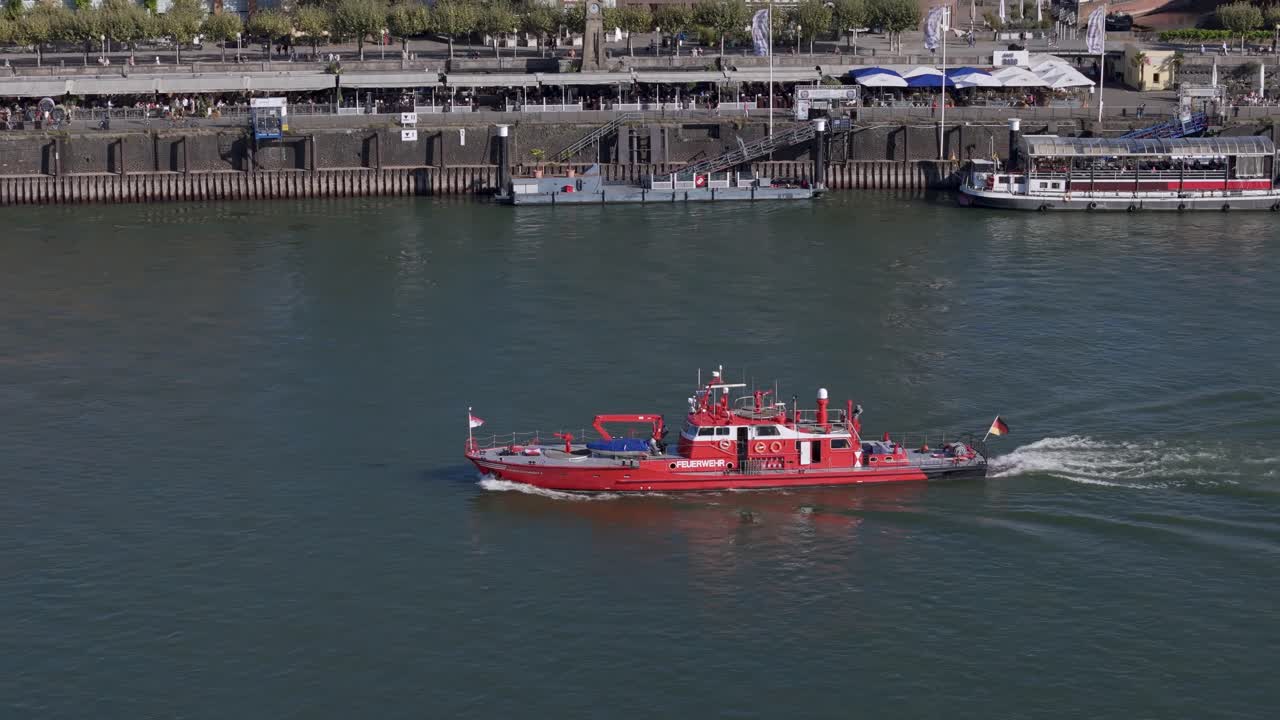 A firefighting vessel sails past the Rhine river near the old town of D&uuml;sseldorf