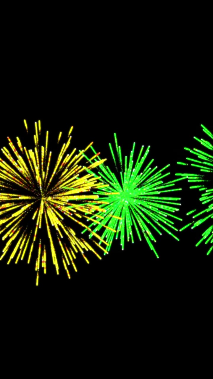 Animazione di fuochi d'artificio gialli e verdi di Natale e Capodanno che esplodono nel cielo notturno.
