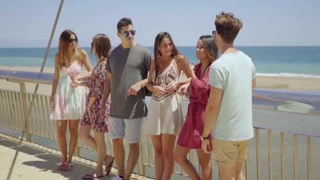 Group-of-teens-hanging-out-near-beach