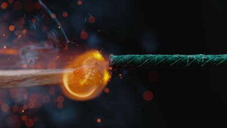 Close-Up-View-of-a-Match-Lighting-a-Firework-Fuse