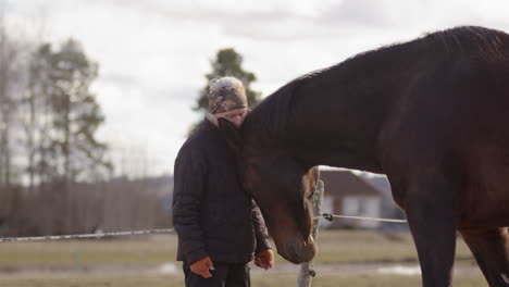 horse initiates physical interaction with woman during equine-assisted therapy