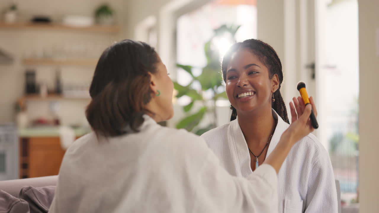 Woman applying makeup to another woman