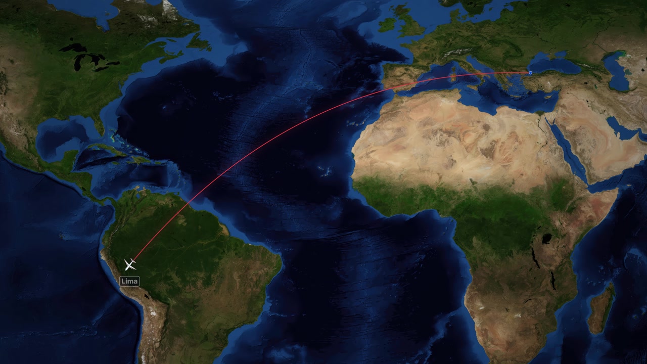 A red line tracks an airplane flying across the Atlantic Ocean on a world map