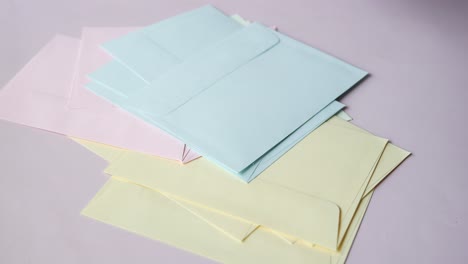 hand pick a envelope from a table ,