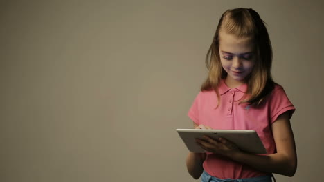 girl using a digital tablet. girl using a digital tablet against white background