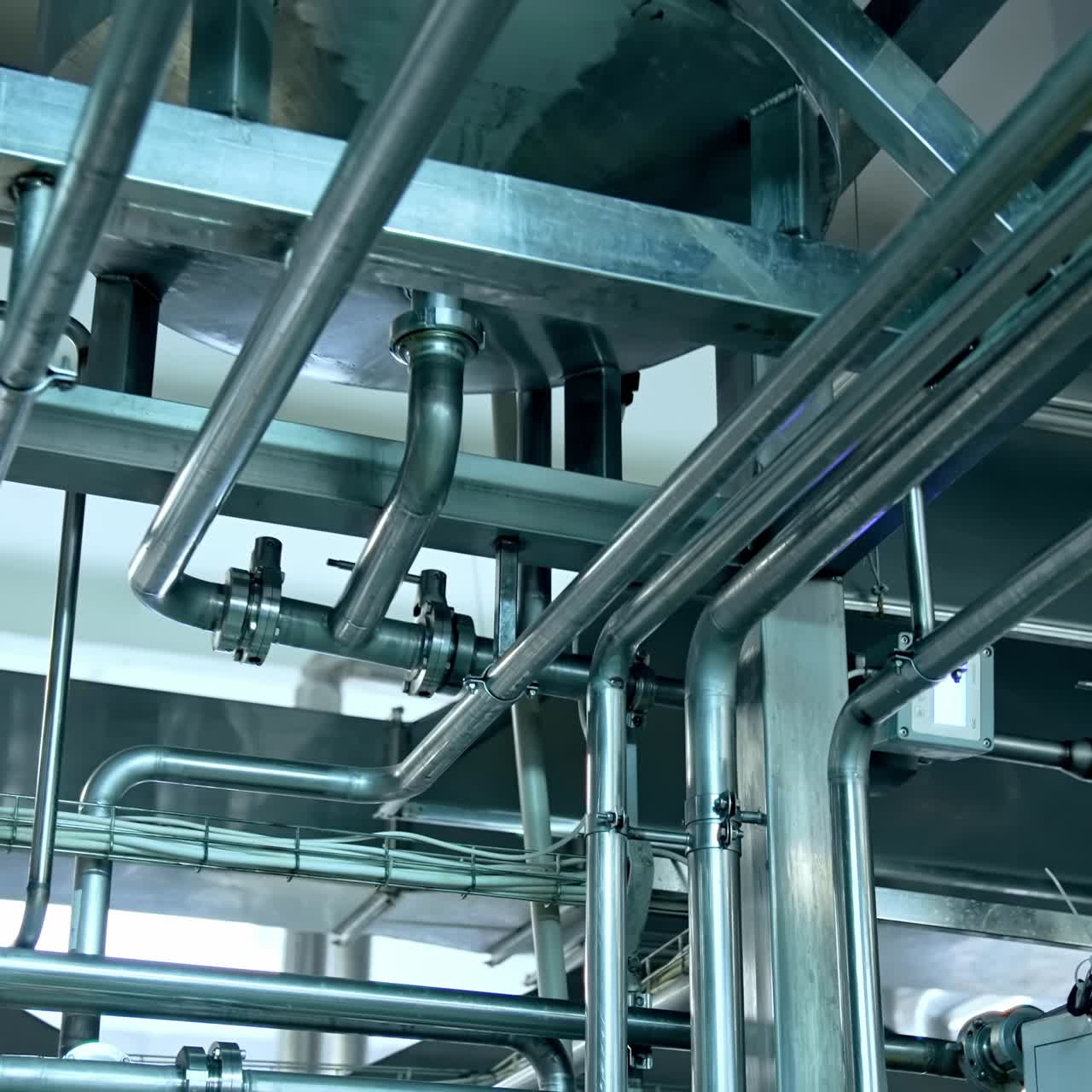 Production of yogurt and milk at dairy factory, industrial equipment for fermentation