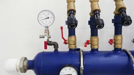 industrial piping system with pressure and temperature gauges