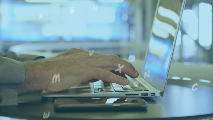 Animation of numbers and letters moving over man typing on laptop