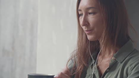 young woman video calling via laptop