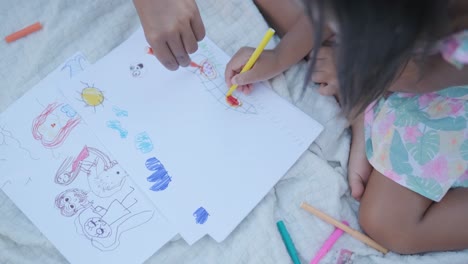 child and parent drawing together