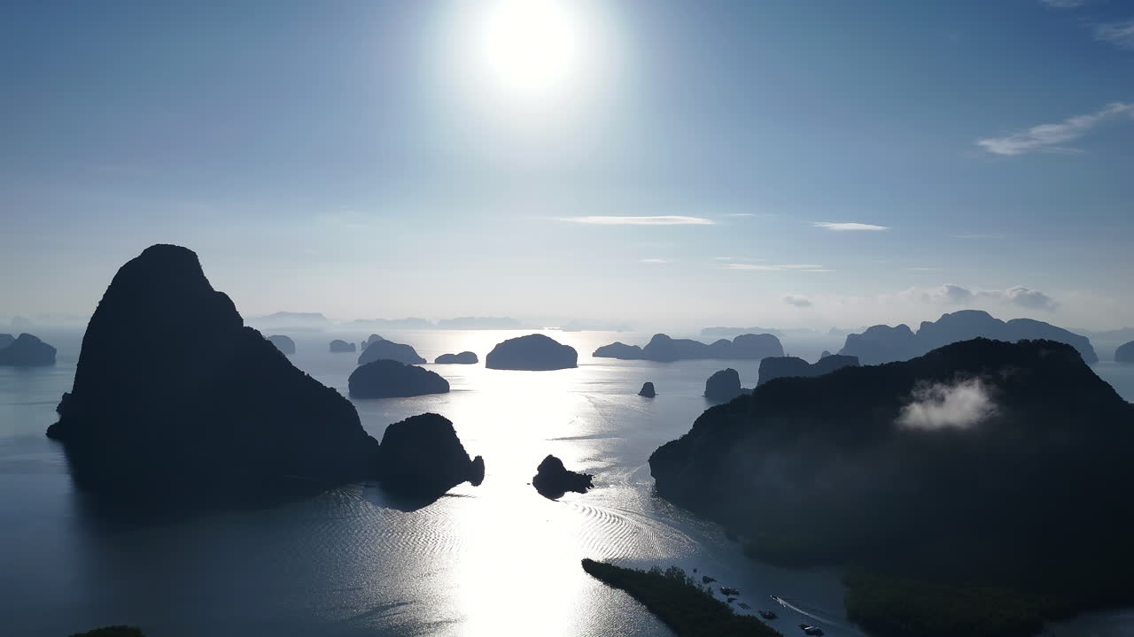Sunrise View Over Calm Waters Of Phang Nga Bay With Limestone Islands In Silhouettes. Andaman Sea In Thailand. static drone shot
