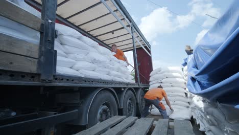 stacking of bags on truck moving to warehouse