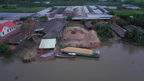 Aerial-view-of-brick-kilns-and-canal-in-Vinh-Long-in-the-Mekong-Delta,-Vietnam