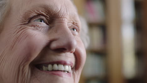 close up portrait of happy elderly caucasian woman smiling cheerful positive looking up