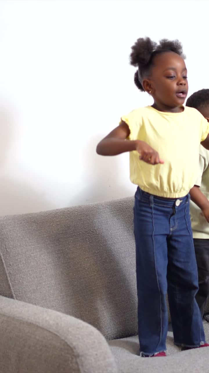 Children playing on a couch