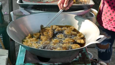 The-Local-Cooking-Tod-Mun,-Thai-Fried-Curry-Fish-Cake,-Made-From-Fresh-Fish-Mixed-With-Curry-and-Cut-Long-Bean-Curd