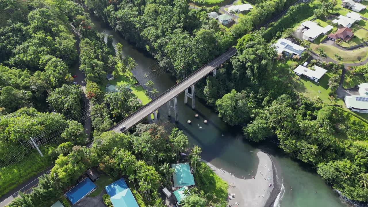 Bird's eye view aerial of Honolii Stream Bridge in Hawaii state, USA, day