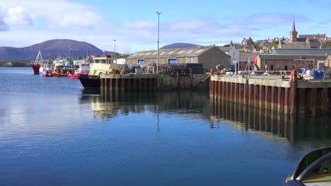 establishing shot of the port at stromness orkney islands scotland