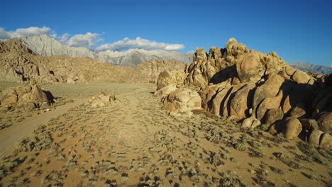 A-high-aerial-sunset-shot-over-the-Alabama-Hills-outside-Lone-Pine-California-with-Mt-Whitney-and-Sierras-background-5