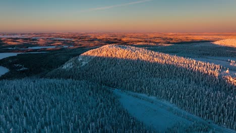 winter landscape with fells and polar nature, evening in lapland - aerial view