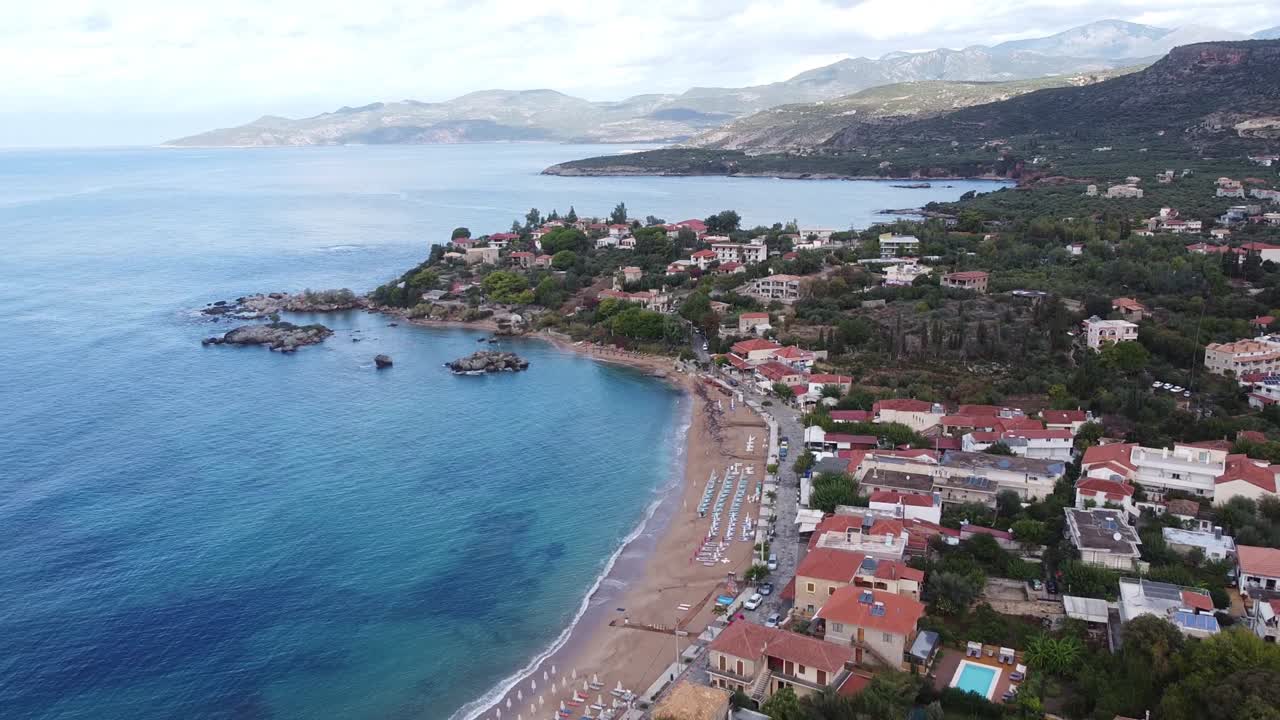 Stoupa Beach Town during Late Summer at Peloponnese, Greece - Reversing Aerial