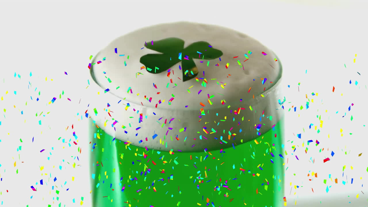 Confetti animation over green beer with shamrock foam for saint patrick's day