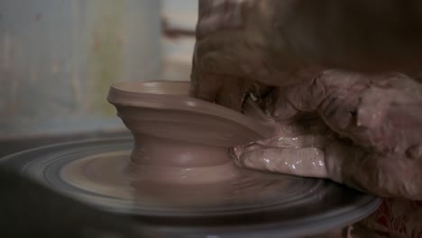 clay breaks in the hands of a man. a man cannot make a clay jug