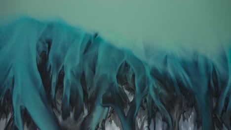 top down aerial of turquoise glacial braided river delta transitioning into blue lake pukaki, top down aerial, new zealand