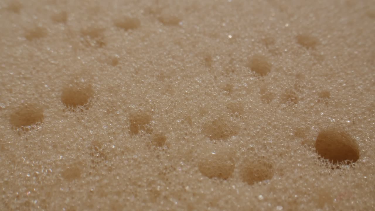 Macro Shot of Beige Foam Texture with Bubbles
