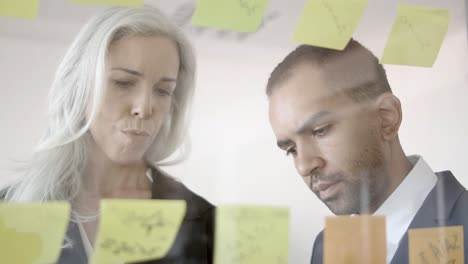 focused business man and woman planning tasks