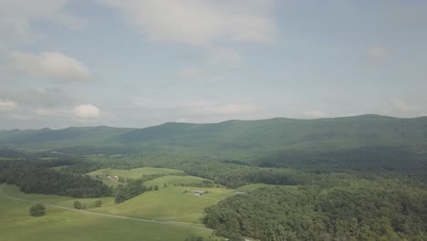 Drone-flying-forward-over-trees-and-forest-in-the-Smoky-Mountains-in-eastern-Tennessee-on-a-partly-sunny-day-for-a-pretty-aerial-shot