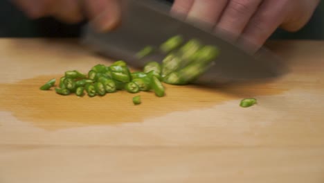 chopping onions and green chili peppers