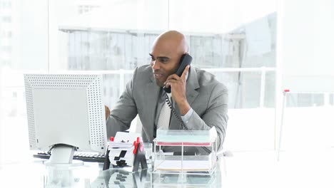 joyful businessman talking on phone