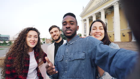 friends taking a selfie in the city