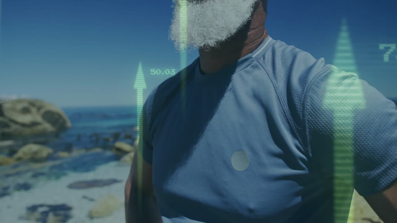 At beach, elderly man using animation for digital financial data visualization
