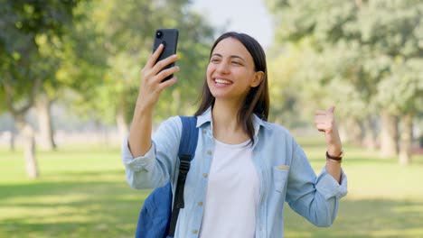 happy indian girl doing video call