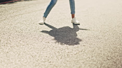 feet, dancing and woman in city street