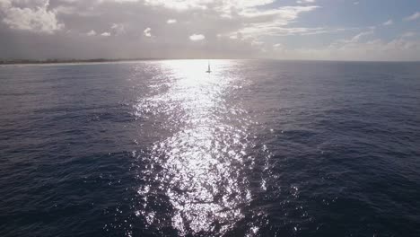 aerial shot of sailing yacht in bright sunlight