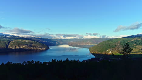 rural village on green fjord of norway