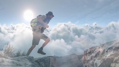 man hiking rocky mountain ridge, showing animated gps route and elevation graph for fitness