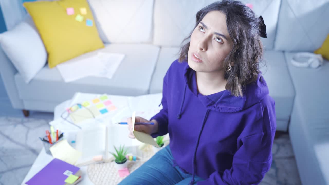 Young woman with Alzheimer's trying to remember.