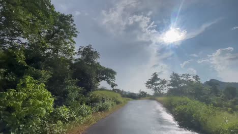 driving across the wet road after the rain near kalsubai-harishchandragad wildlife sanctuary in western ghats, maharashtra india